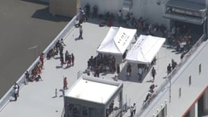 aerial view of people standing on a roof