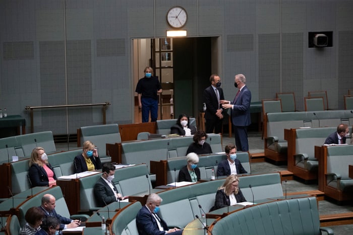 The leader of the House Tony Burke talks to the Greens leader Adam Bandt in the house of representatives