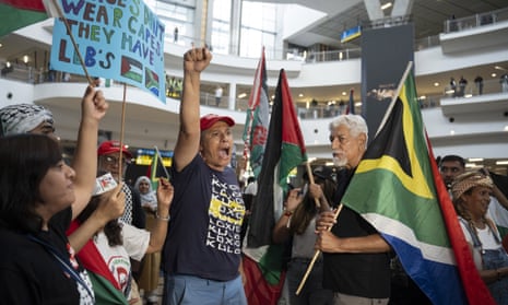 Supporters of Tembeka Ngcukaitobi gather at O R Tambo international airport, Johannesburg, to welcome him home after he represented South Africa in the genocide case against Israel at The Hague.