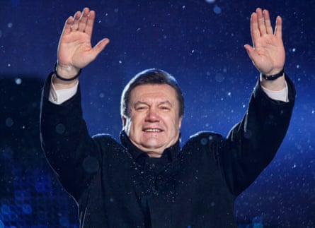 Viktor Yanukovych greets supporters during a campaign rally in Kiev in 2010.