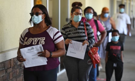 Voters wait in line to deposit their vote-by-mail ballot at the Broward county supervisor of elections office in Florida’s primary election on Tuesday.