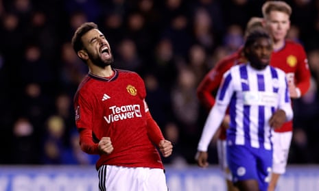 Manchester United's Bruno Fernandes celebrates scoring their second goal at Wigan.