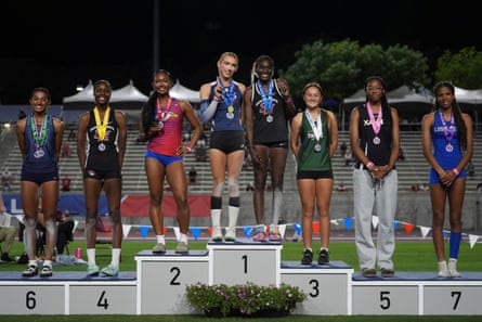 people stand on a podium
