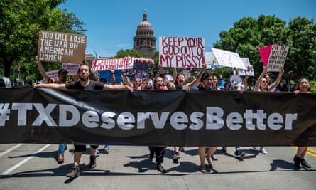 Protesters march outside the Texas state capitol in Austin.