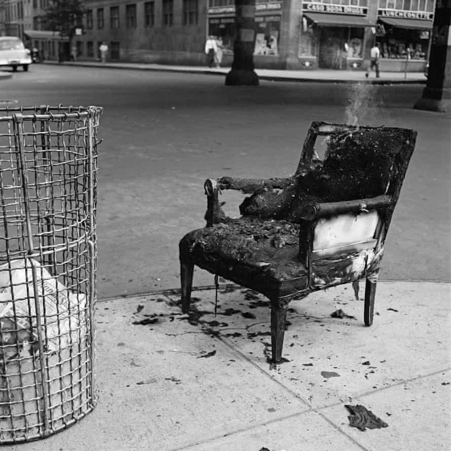 A burnt-out armchair next to a wire bin … New York, 1954.