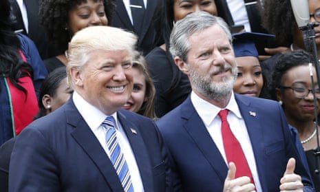 Donald Trump poses with Jerry Falwell Jr in May. Falwell said Trump’s response to Charlottesville was ‘bold’ and ‘truthful’.