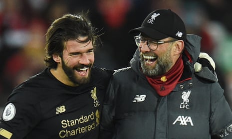 Jürgen Klopp celebrates the 3-2 comeback win against West Ham with the Liverpool goalkeeper, Alisson, at Anfield.