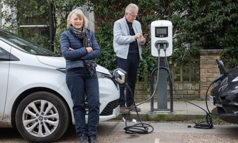 Ros Coward and her partner John top up their Renault Zoe at a charging point in Whitstable, Kent