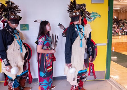 Three dancers talking to each other, round the corner from the hall