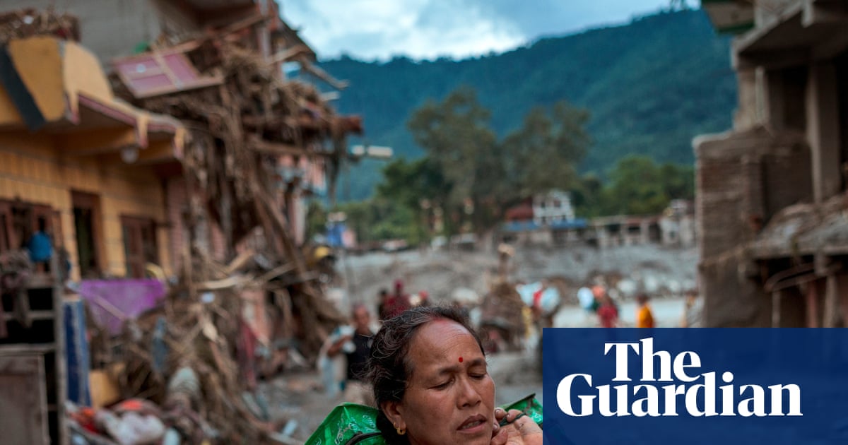 Nepal-Tibet death toll rises amid new flood fears and race to free group trapped in tunnel