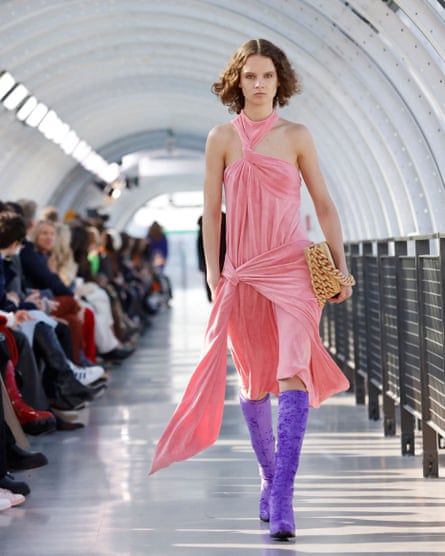 A model wears a pale pink ruched dress by Stella McCartney as part of her fall/winter 2022/2023 women’s ready-to-wear collection show at Paris fashion week.