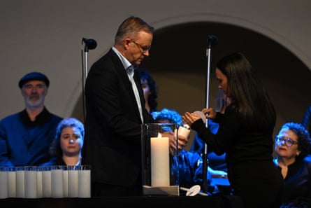 Anthony Albanese lights a candle at a vigil to honour the victims of the Bondi Junction tragedy