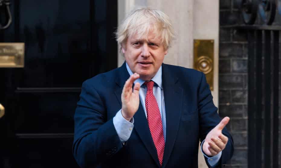 Boris Johnson outside 10 Downing Street during a weekly 'clap for our carers' for the NHS and key workers in May 2020.