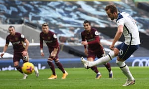 Tottenham Hotspur’s English striker Harry Kane scores a penalty.