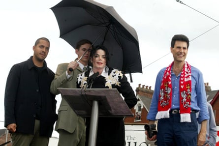 Michael Jackson holds forth at Exeter City as David Blaine and Uri Geller look on.