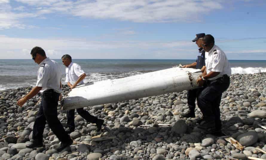 Officers carry debris in Saint-Andre de la Reunion, eastern La Reunion island, France in 2015.