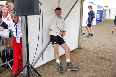 An English competitor in the junior men’s 560kg competition watches on from the call tent.