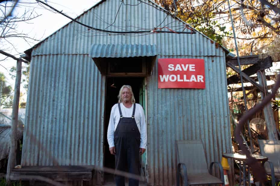 Col Faulker, 68, over 40-year resident of Wollar, NSW standing at the entrance of his home. A town now predomintaly owned by American coal-mining company Peabody.