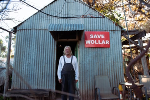 Col Faulker, 68, over 40-year resident of Wollar, NSW standing at the entrance of his home. A town now predomintaly owned by American coal-mining company Peabody. 