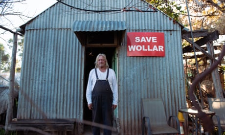 Col Faulker, 68, over 40-year resident of Wollar, NSW standing at the entrance of his home. A town now predomintaly owned by American coal-mining company Peabody.