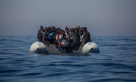 African migrants float in a rubber dinghy off the Italian coast in 2017.