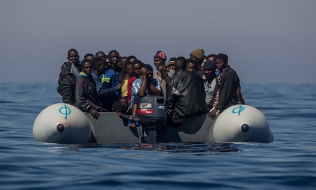 Refugees and migrants in an overcrowded rubber boat