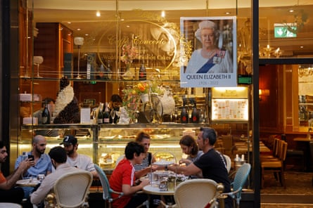 A picture of The Queen in the window of a cafe on Regent Street