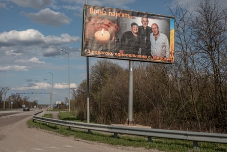 A large billboard of Olga Petrivna with her husband and son marks the entrance to Motyzhyn village. The message reads: ‘Eternal respect from the people of Motyzhyn.’