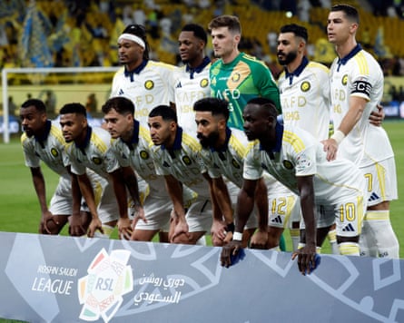 Al-Nassr players pose for a team photo before the Saudi Pro League match between Al-Nassr and Al-Khaleej