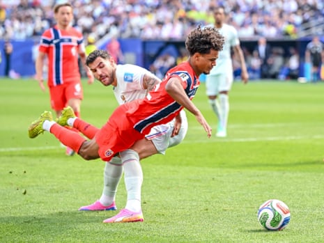 Theo Hernandez of France fouls Oscar Bobb of Norway and the referee points to the spot.