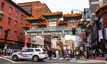 Protesters attend a day of action against Anti-Asian violence at the Chinatown Gate in downtown Washington on 27 March.