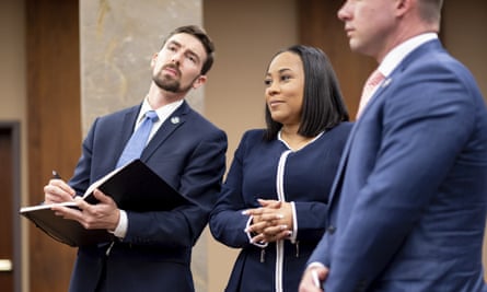 The Fulton county district attorney, Fani Willis, center, and members of her team in May 2022.