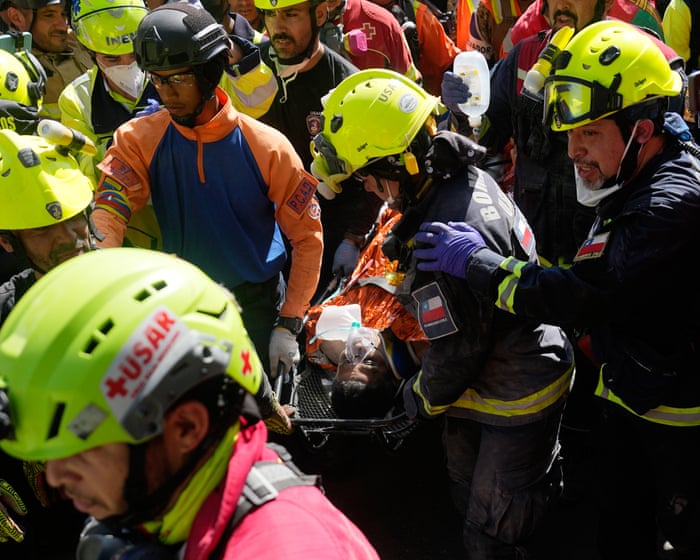 Man pulled alive from collapsed Venezuela shopping centre eight days after earthquakes – video
