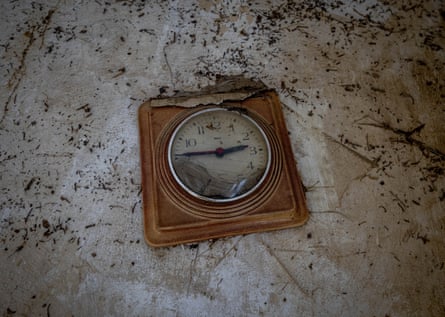 A damaged clock from last year’s floods hangs on a wall in the village of Schuld.