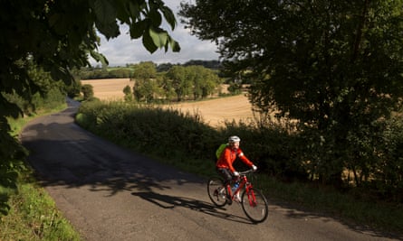 Helen Pidd cycling through countryside near Hadrian's Wall
