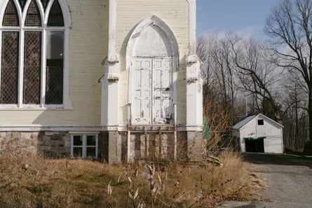 overgrown grass in front of church