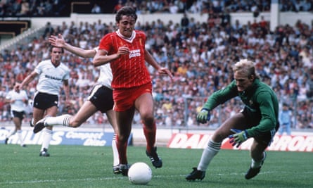 Liverpool’s Michael Robinson attempts to beat Manchester United’s Gary Bailey during the 1983 Charity Shield at Wembley.