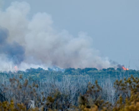 Smoke rising from a fire seen across a heath
