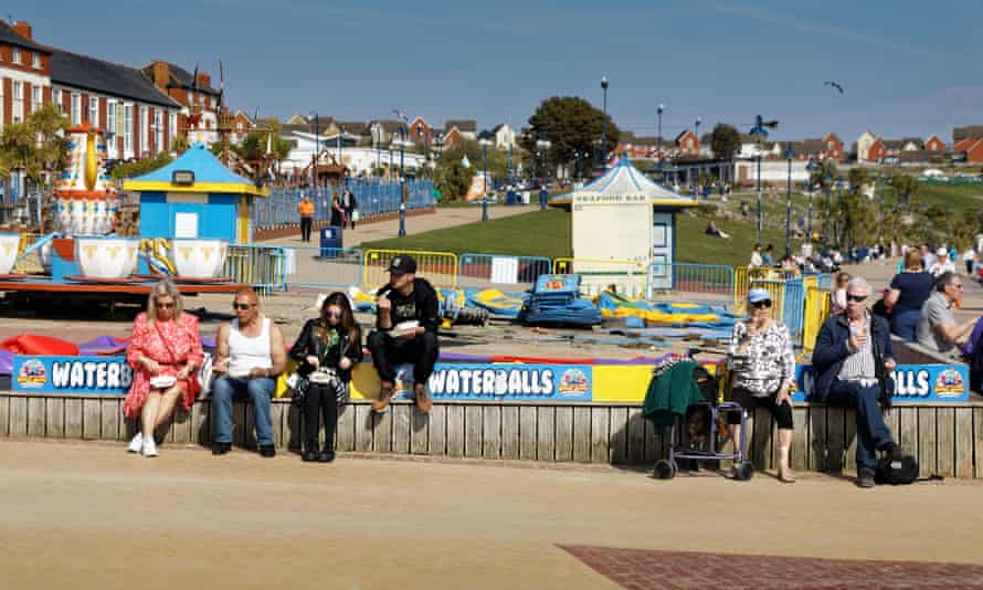 People enjoy the sunshine on the beach in Barry Island as the election campaign gathers pace.