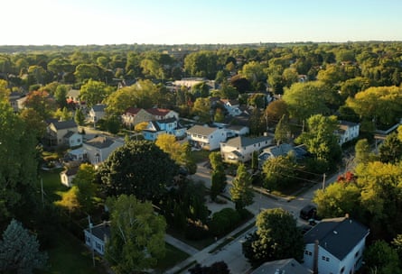 an aerial view of Port Washington showing trees and houses