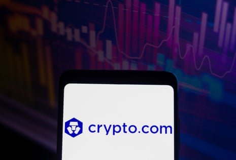 The logo of crypto.com is displayed on a smartphone screen