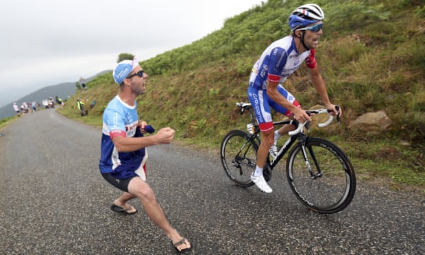 A fan offers their support to France’s Thibaut Pinot as he climbs during the 15th stage of this year’s Tour de France.