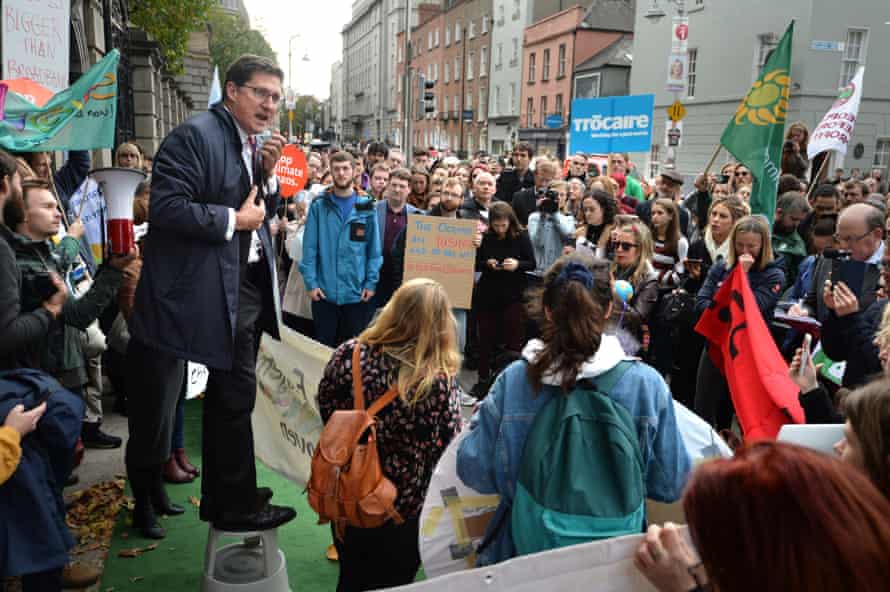 Irish Green Party leader Eamon Ryan addresses a climate change demonstration outside Irish government buildings on 16 October 2018
