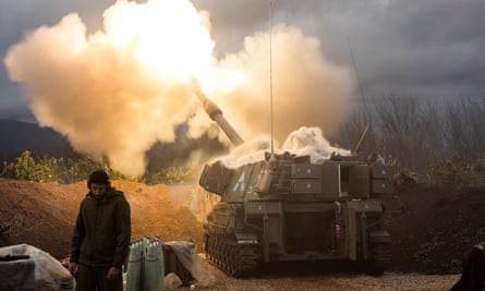 An Israeli artillery unit fires across the border towards Lebanon on January 11.