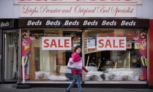 Local Authority Budgets Wigan<br>© Joel Goodman for the Guardian - 07973 332324 - all rights reserved . 22/10/2018 . Leigh , UK . A woman walks past a bed shop on Railway Road . Local authorities are adopting different approaches to manage cuts in funding after years of austerity . Photo credit : Joel Goodman