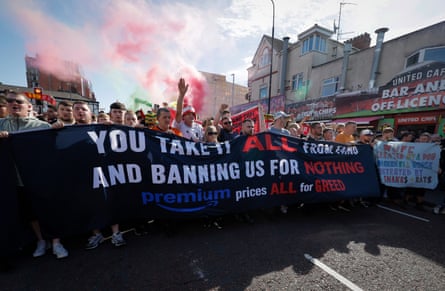 United fans demonstrate against pricing and banning orders from the club before the Premier League match between Manchester United and Manchester City at Old Trafford.