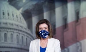 US speaker of the house, Nancy Pelosi, wears a mask as she arrives at her weekly press conference on Capitol Hill.