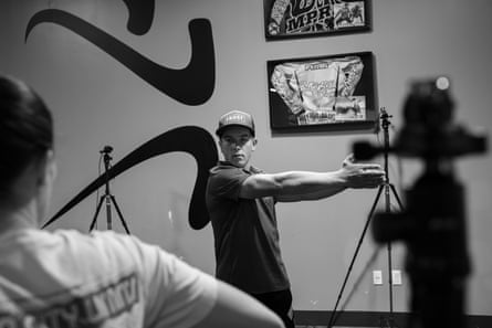 A man stretches during a testing exercise
