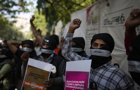 Gig Amazon Warehouse workers along with others shout slogans during a protest in New Delhi, Friday, Nov. 25, 2022. The protest was against the alleged unfair treatment and work environment by multinational companies against their workers.
