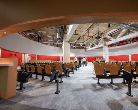 Rows and row of chairs inside a circular auditorium of the Sloane Robinson building